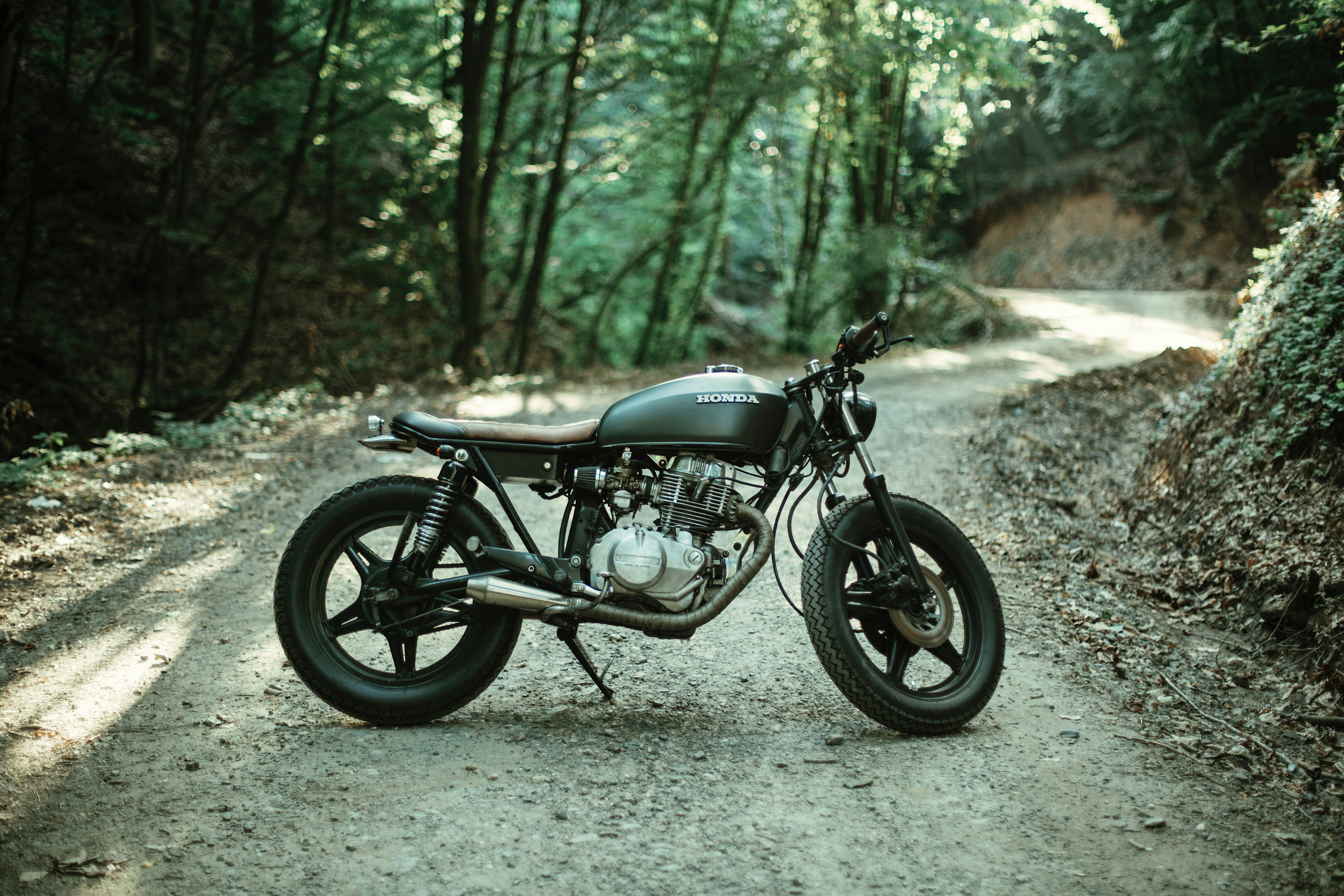 Motorcycle on dirt track at sunset